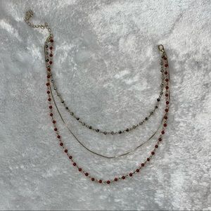 Gold and marbled beaded necklace